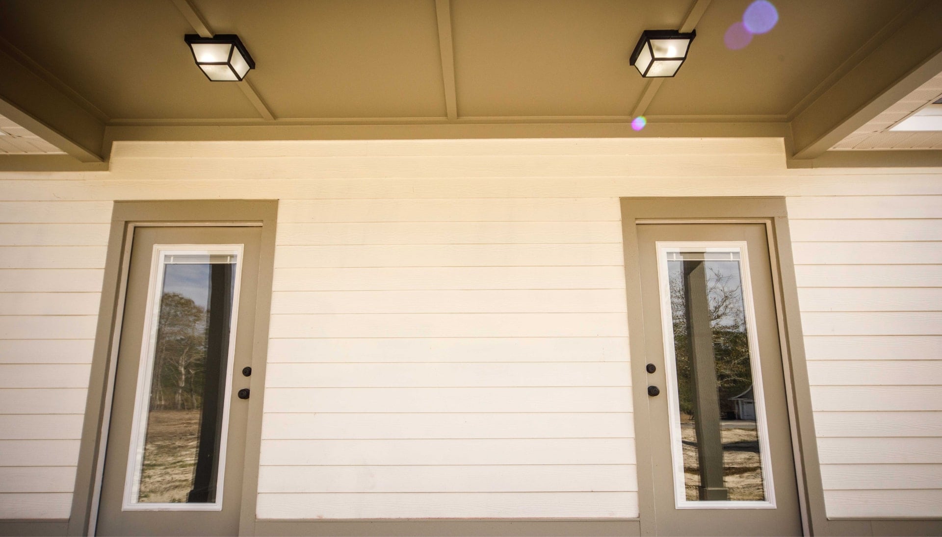 We offer siding services in Mattoon, Illinois. Hardie plank siding installation in a front entry way.